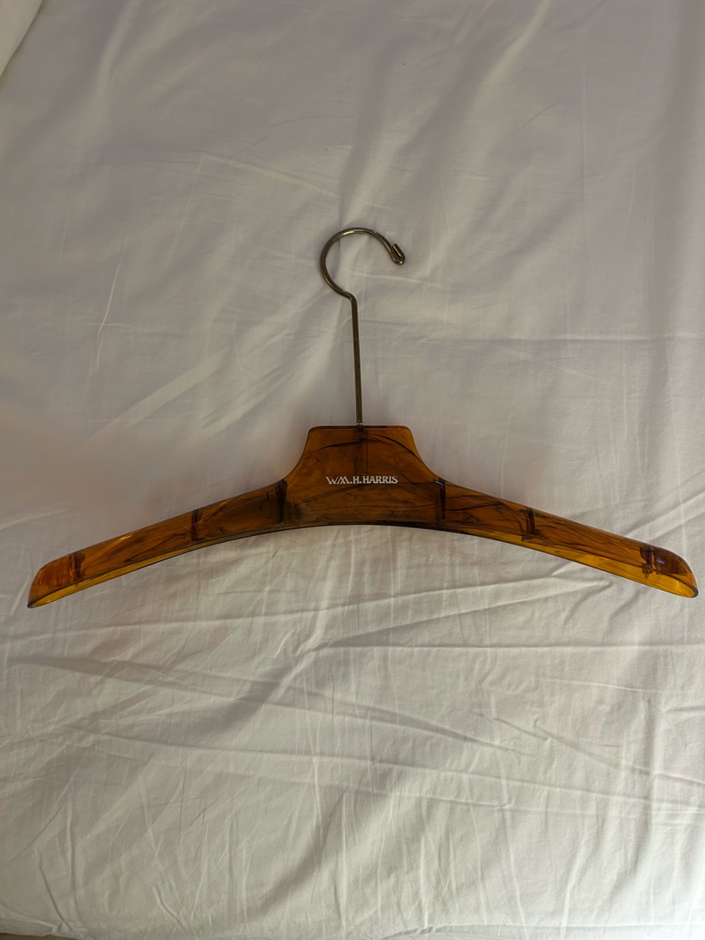 WM. H. HARRIS furs, Amber colored Hanger for heavy coats, etc.